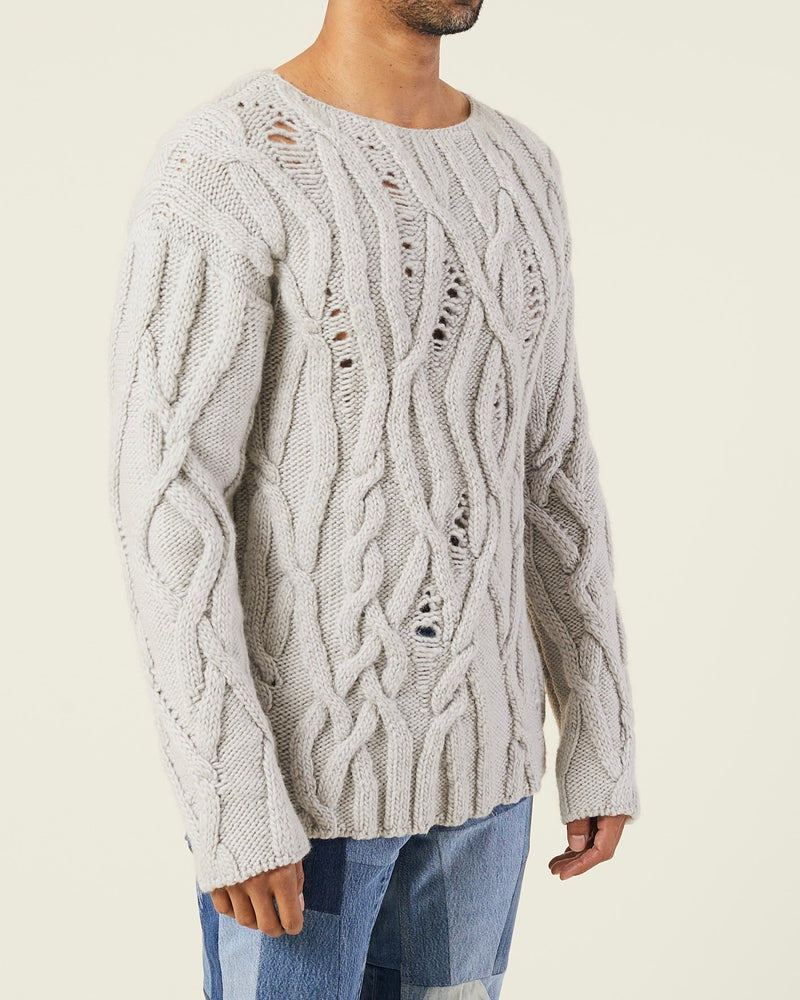 OVERSIZED DISTRESSED CABLE-KNIT SWEATER